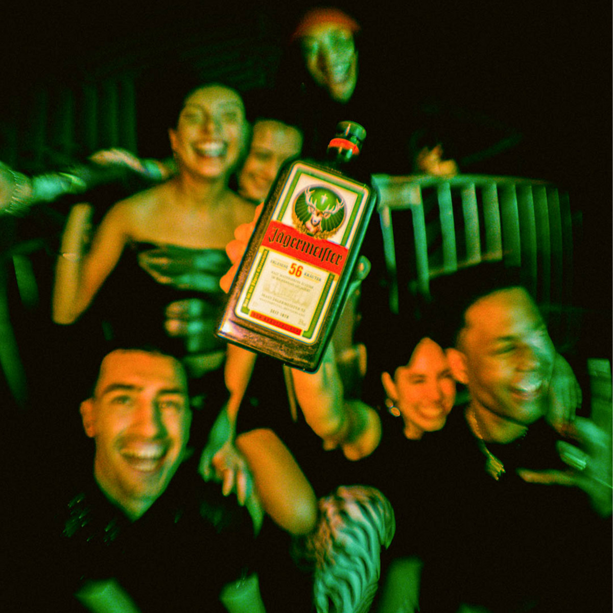 A group of young people are partying with Jägermeister in the club