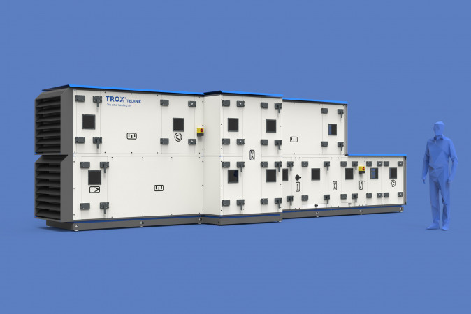Rendering eines X Cube von Trox neben einer fiktiven Person auf blauem Hintergrund